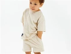 Dreng med beige meleret shorts fra THE NEW Siblings Norval TNST6035